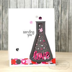 a handmade card with the words sending you love in pink and black on it