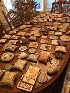 the table is covered with many different pieces of cloth