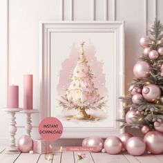 a pink christmas tree surrounded by ornaments and candles in front of a white framed wall