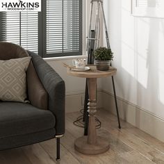 a living room with a chair, table and window blinds on the windowsills