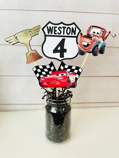 cars birthday centerpieces in a mason jar