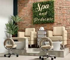 two chairs and one chair are in front of a brick wall that says spa and perfume