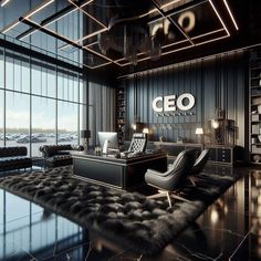 an office with black furniture and large windows