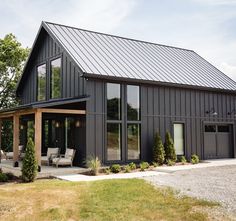 a large gray house with lots of windows