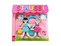 a pink toy house with two girls in front of it and the words stausi on