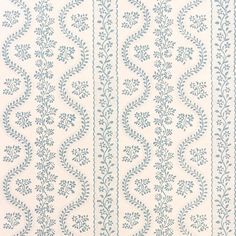 a white and blue wallpaper with vines on it