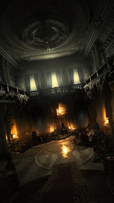 an empty ballroom with candles lit up in the dark