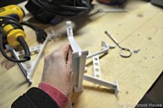 a person is working with some tools on a table