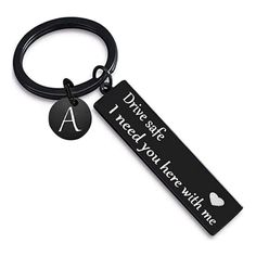 a keychain with the words drive safe and i need to know what's in