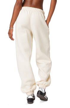 An oversized fit and handy pockets bring trendy comfort to these cotton-blend sweatpants that you'll love for your off-duty look. 50% cotton, 50% polyester Machine wash, dry flat Imported Cheap Trendy Cotton Joggers, Affordable Baggy Sweatpants, Nude Nike Sweatpants, Cute Nike Sweat Pants, Nike Sweatpants Cute, Cute Nike Sweats, Trendy Wide-leg Cotton Joggers, Beige Athleisure Sweatpants For Streetwear, Spring Cotton Joggers With Ribbed Waistband