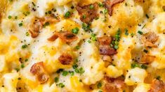 a close up view of a casserole dish with cheese and bacon on it