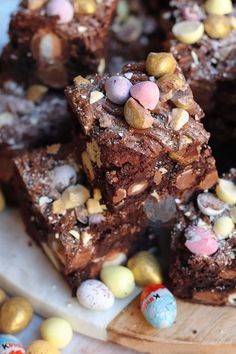 chocolate brownies with candy eggs and candies on a cutting board