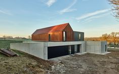 the house is made out of concrete and has a metal roof