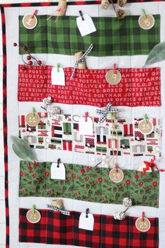 a quilted christmas stocking display hanging on a wall