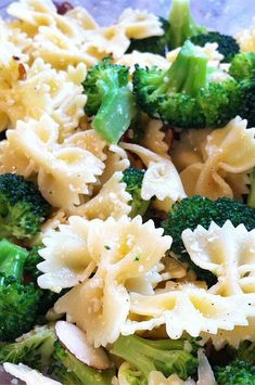 pasta and broccoli are mixed together in a dish that is ready to be eaten