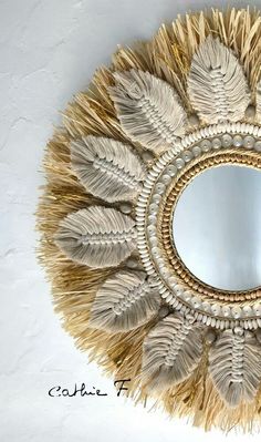 a mirror that has some feathers on it