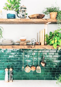 the shelves are filled with pots, pans and other kitchen utensil items