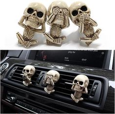 three skeleton figurines sitting on the dashboard of a car, next to an air vent