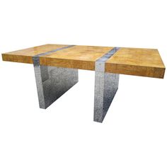 a wooden table with metal legs on a white background