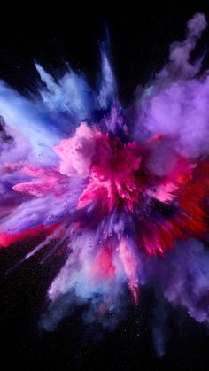 an explosion of colored powder is seen in this artistic photo taken by the camera man