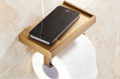 a cell phone sitting on top of a wooden holder