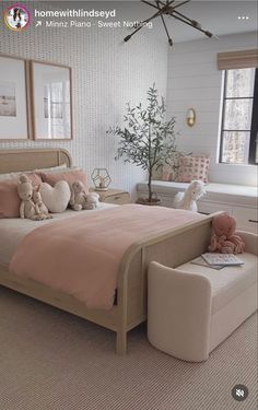 a bed room with a neatly made bed and two teddy bears