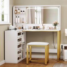 there is a vanity with a mirror and stool in the room