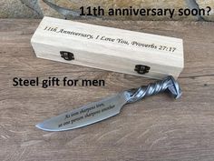 a wooden box with a knife in it and the words, 11 th anniversary soon