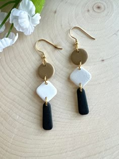 Neutral geometric polymer clay dangle earrings. Tan, off white and black to go with every outfit. Hardware is 18k gold plated. This item is handmade and may vary slightly in appearance. Clay Photography, Earrings Diy Handmade, Diy Leather Earrings, Clay Dangle Earrings, Earrings Polymer