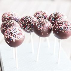 chocolate covered cake pops with sprinkles on top