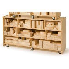 a large wooden shelf with many different items on it's sides and wheels for storage