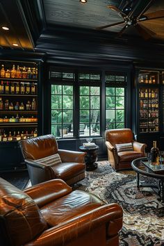 a living room filled with lots of leather furniture