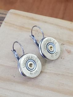 High quality stainless steel lever backs with 28 gauge shotgun casings. Soldered bezels, sturdy and are a great everyday earring style. Choose from brass old style Winchester casings or brass Fiocchi brand casings. Crystals are optional. Use dropdowns to make your selections. When you don't want a post/stud, but you aren't into long dangles, these are a perfect choice. Super lightweight. See our optional shotshell lever backs in both 410 gauge (slightly smaller diameter) and 20 gauge (slightly l Bullet Designs, Female Hunter, Bullet Earrings, Bullet Jewelry, Everyday Earrings, Old Style, Winchester, Fashion Earrings, Brass