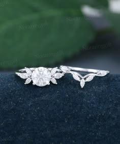 a diamond ring with leaves on it