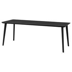 a black table sitting on top of a white floor