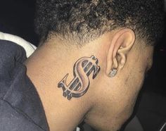 a man with a dollar tattoo on his neck