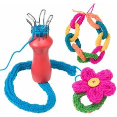 three different types of yarn and scissors on a white background with one being used as a hair clip