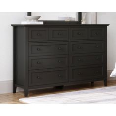 a black dresser with drawers in a room