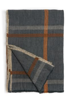 a blue and brown plaid blanket with fringes