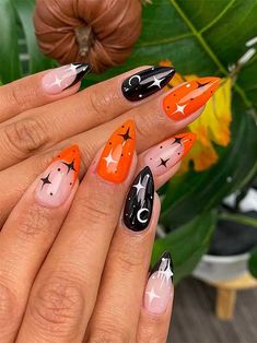 Orange and black Halloween nails with celestial nail art and two French accent nails. Sq Oval Nails, October Nails Halloween Ideas, Jackolantern Nails, Halloween Theme Nails, Spooky Nail Art, Witch Nails, Witchy Nails