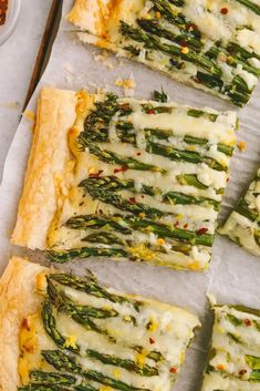 asparagus and cheese puff pastry on parchment paper