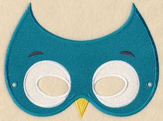 a blue mask with white eyes and a yellow beak is shown in the shape of an owl