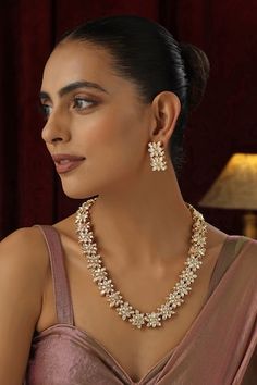 Gold plated long necklace studded with clear polki floral cluster motifs. Comes with matching pair of earrings. - Aza Fashions Long Necklace Set, Jewellery Sets, Buy Gold, Gold Brass, Aza Fashion, Long Necklace, Necklace Set, Jewelry Sets, Gold Plate