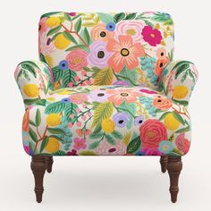 an upholstered chair with colorful flowers on it