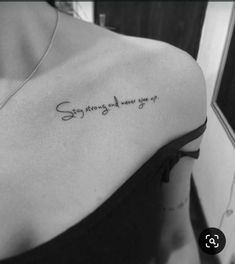 the back of a woman's shoulder with an inscription on it that says, someone is