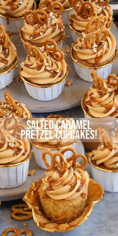 some cupcakes with caramel frosting and pretzel toppings