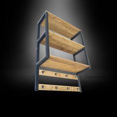 a three tiered wooden shelf sitting on top of a black floor