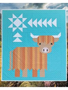 a brown cow standing on top of a field next to tall green grass and mountains