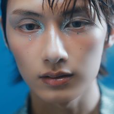 a close up of a person with water on their face