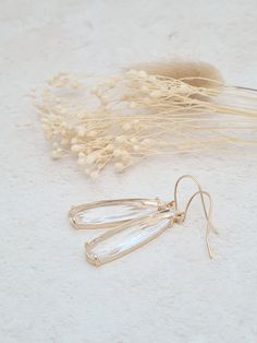 Elegant long clear glass earrings with gold plated earring wires. These earrings will add an elegant and stylish touch to any outfit.   The earrings measure 1.5in/3.5cm in length from the top of the earring wires. Elegant Clear Earrings As Gift, Neutral Earrings, Earrings Art Deco, Bridal Earrings Drop, Glass Drop Earrings, Deco Earrings, Earrings Art, Earring Wires, Long Drop Earrings